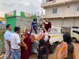 Distribution of Food to the Needy   </br> 救濟附近貧困居民活動